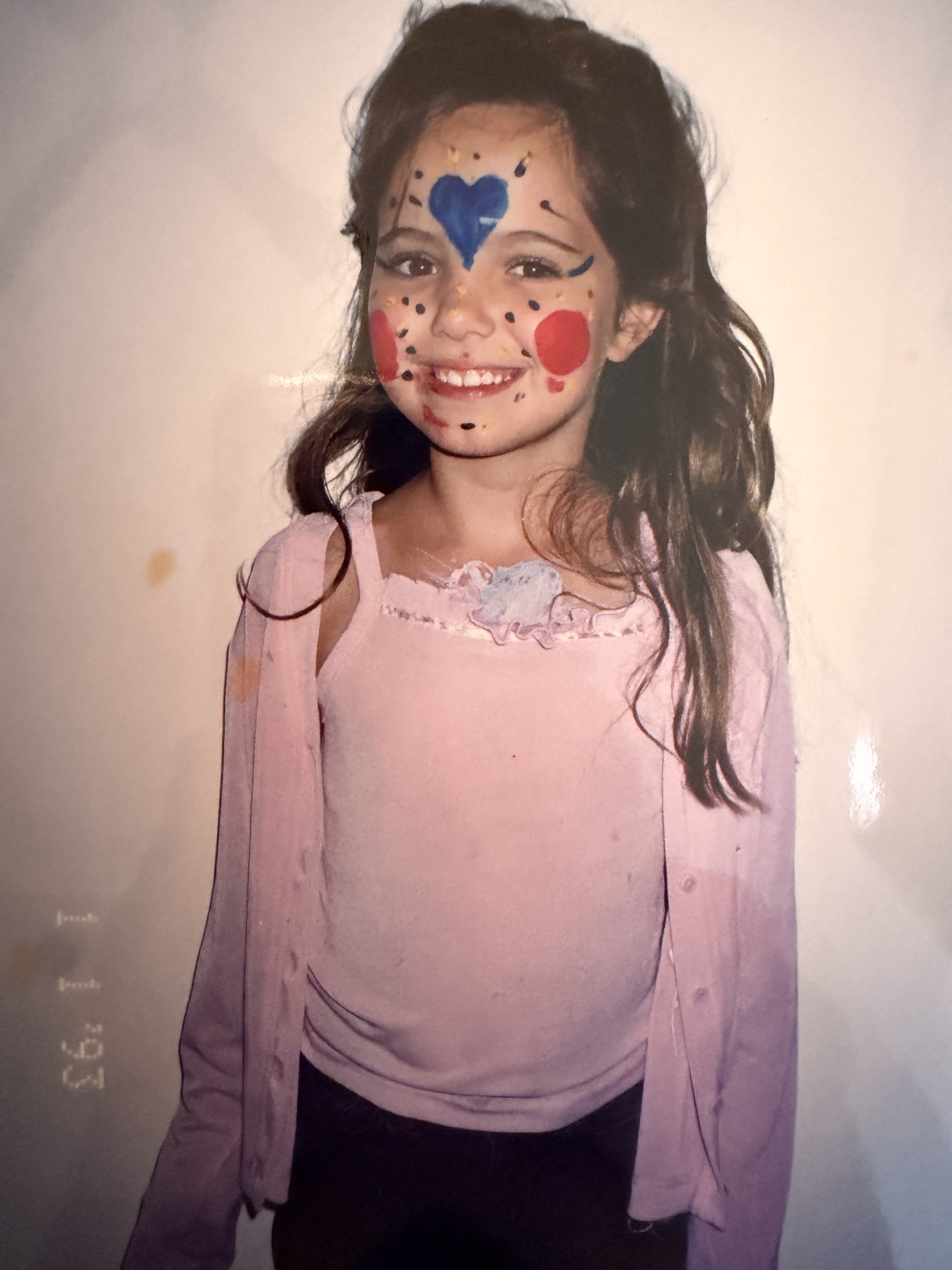 A young Kristyn — the lived experience that grounds the work.