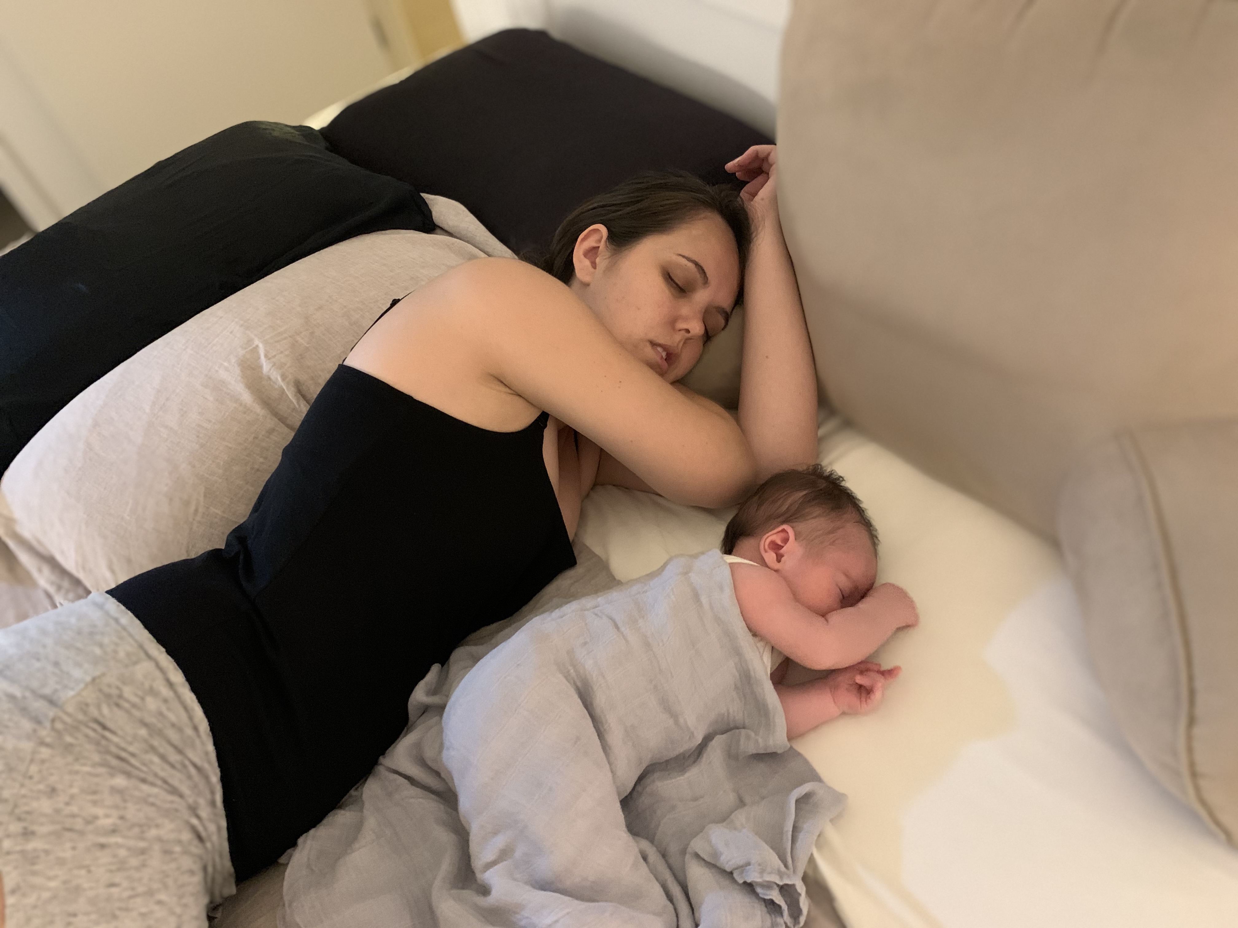 Kristyn and her baby, asleep together.